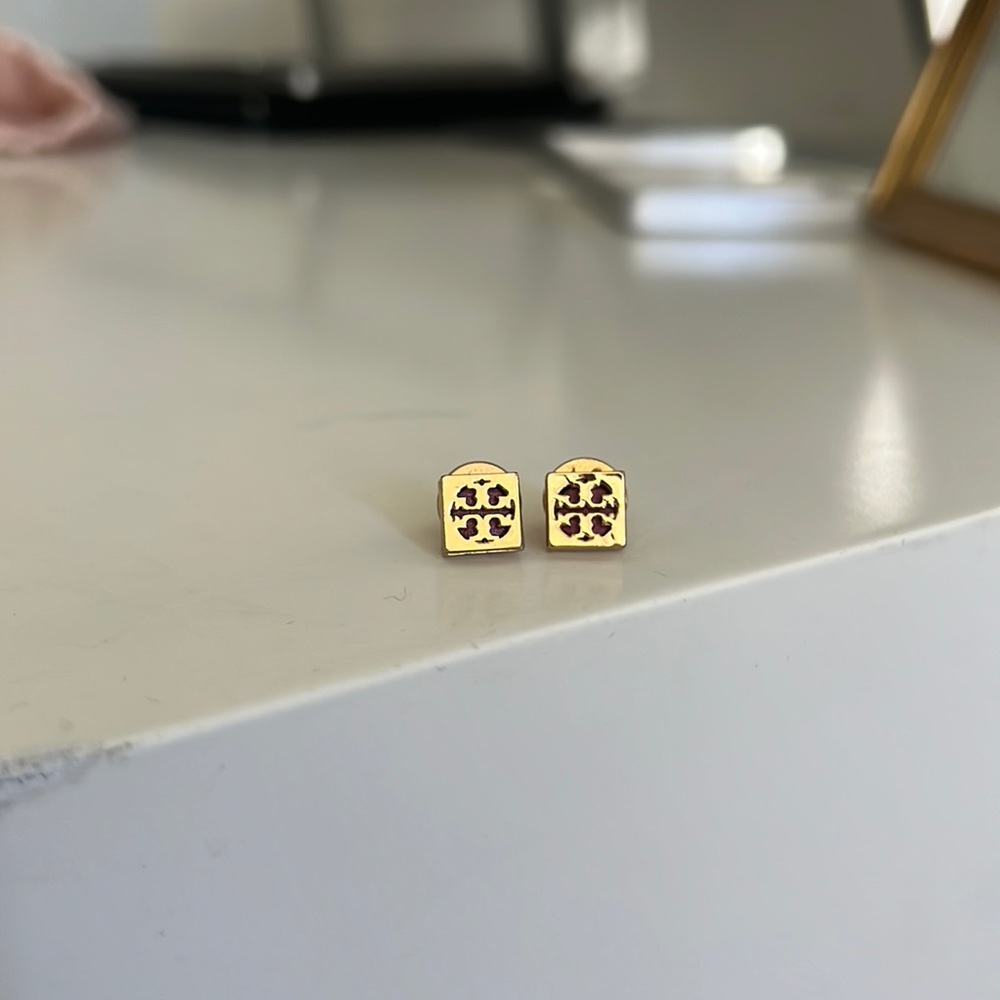 Tory Burch gold earrings with purple center